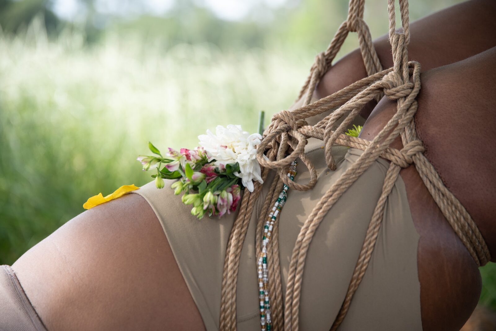Rope across skin in close detail.