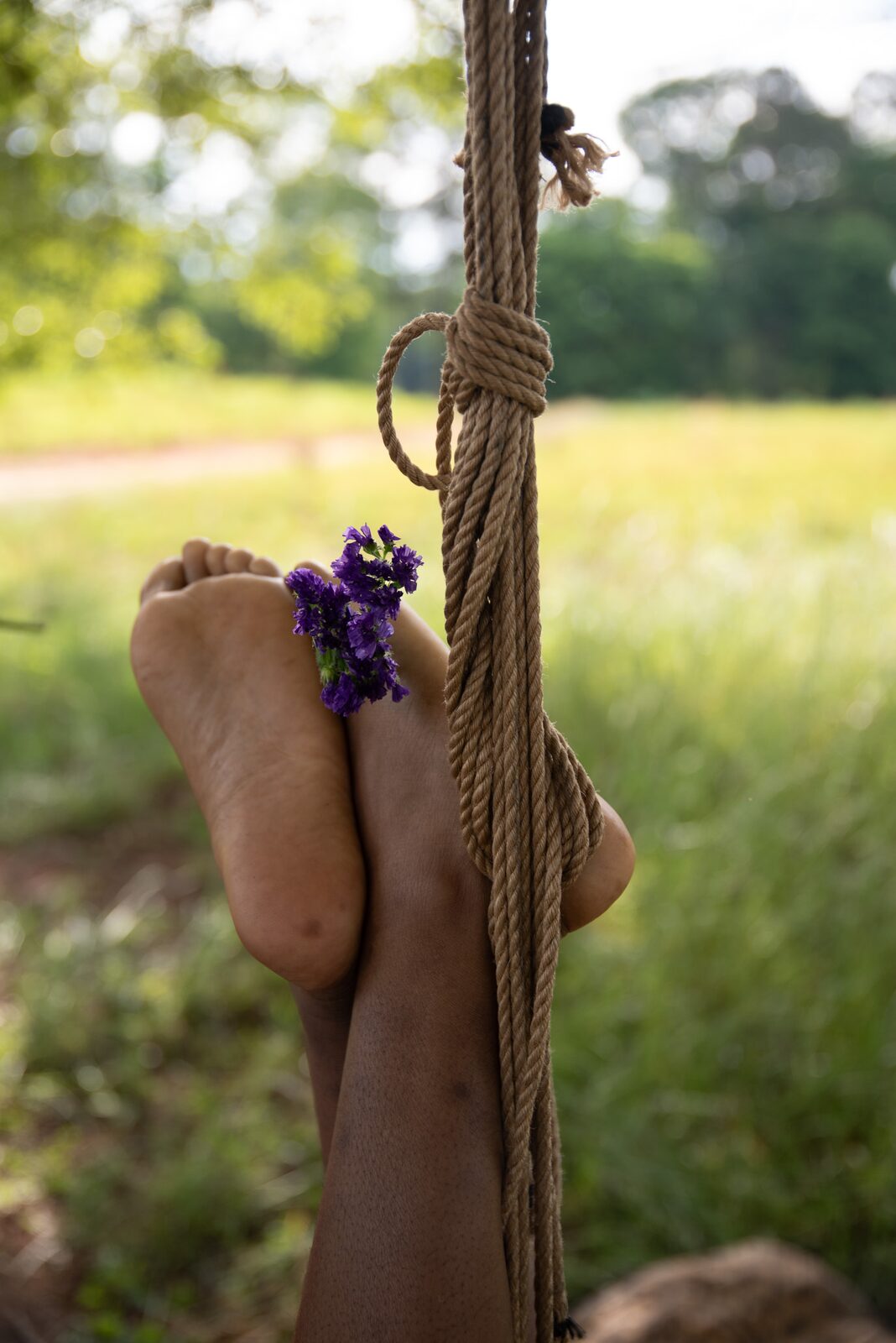 A texture moment — skin, jute, petal.