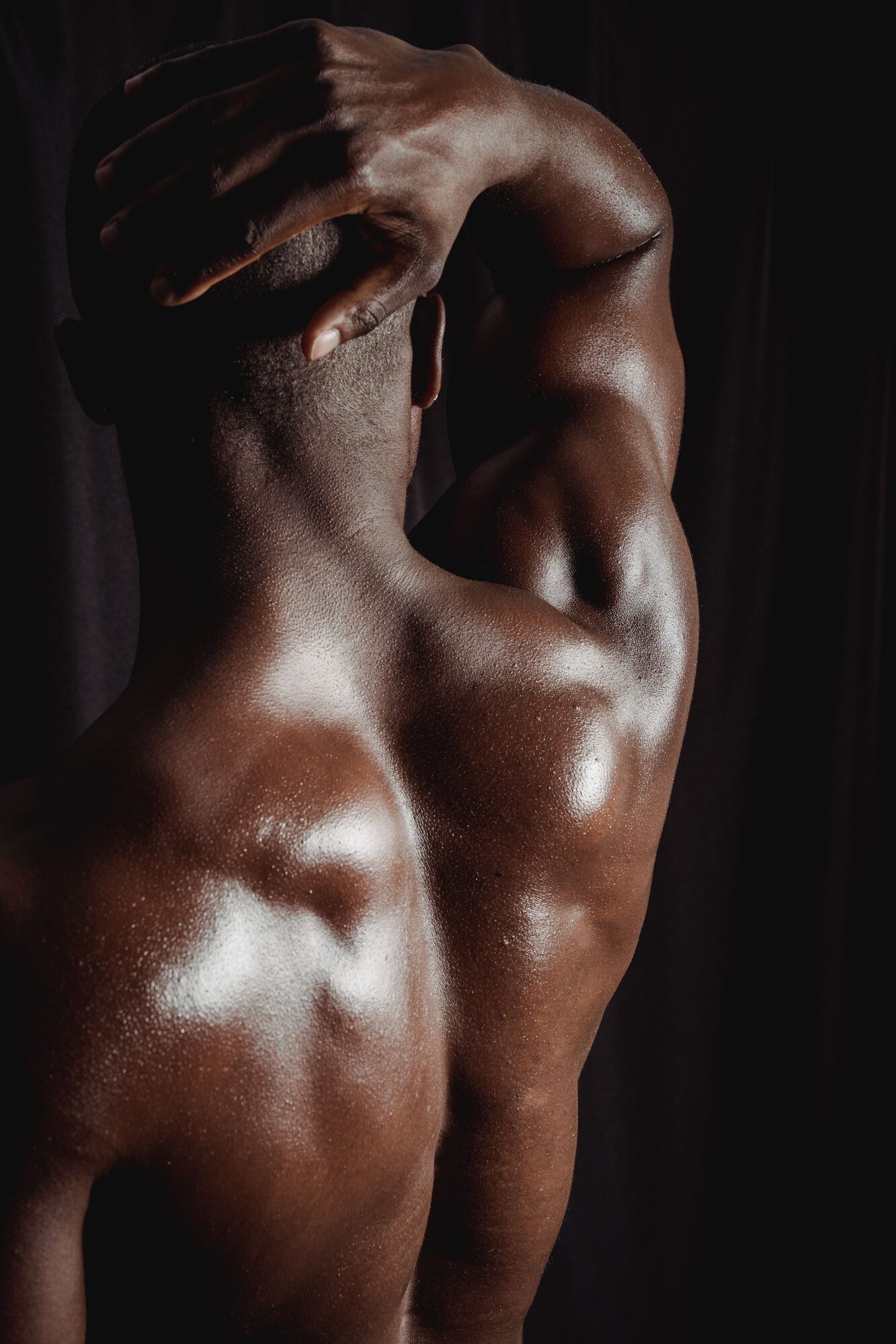 Mood still: a back turned to warm light.