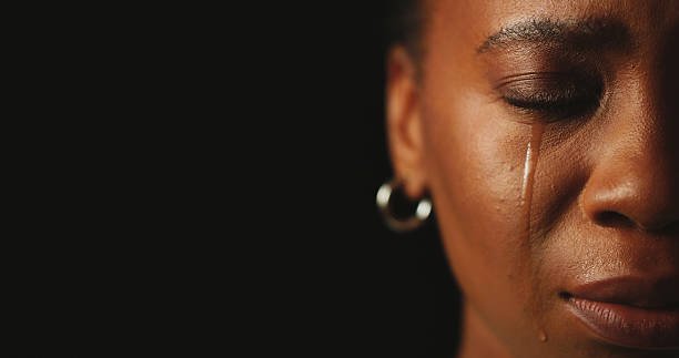 Person in rope, still and held, mid-session